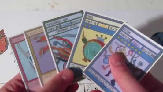 Hand holding fanned out Pokemon trading cards illustrating professional trading cards.